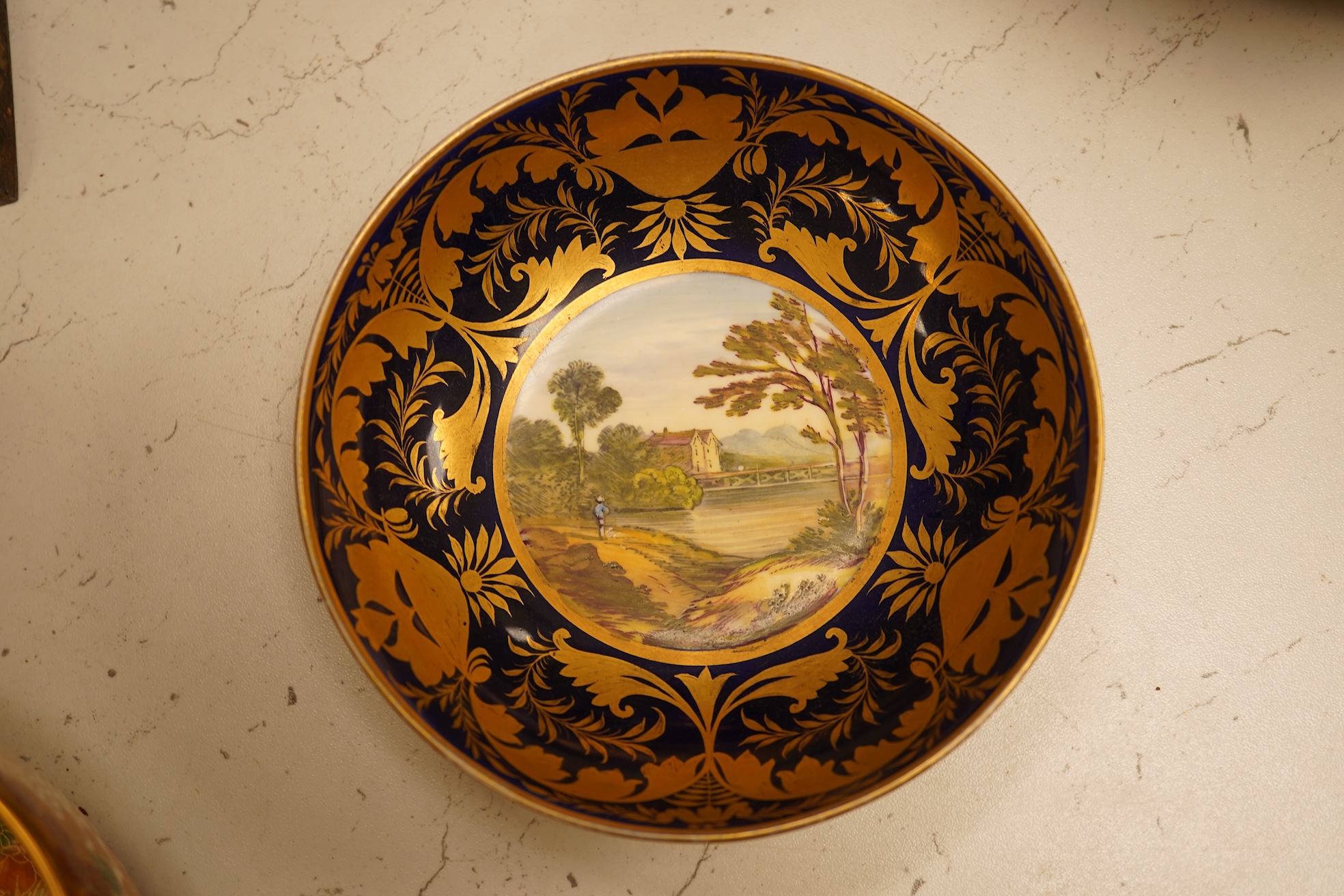 A collection of Royal Crown Derby, to include a two handled bowl, a fluted pedestal vase, saucer with landscape central cartouche etc (5). Vase 19cm high.